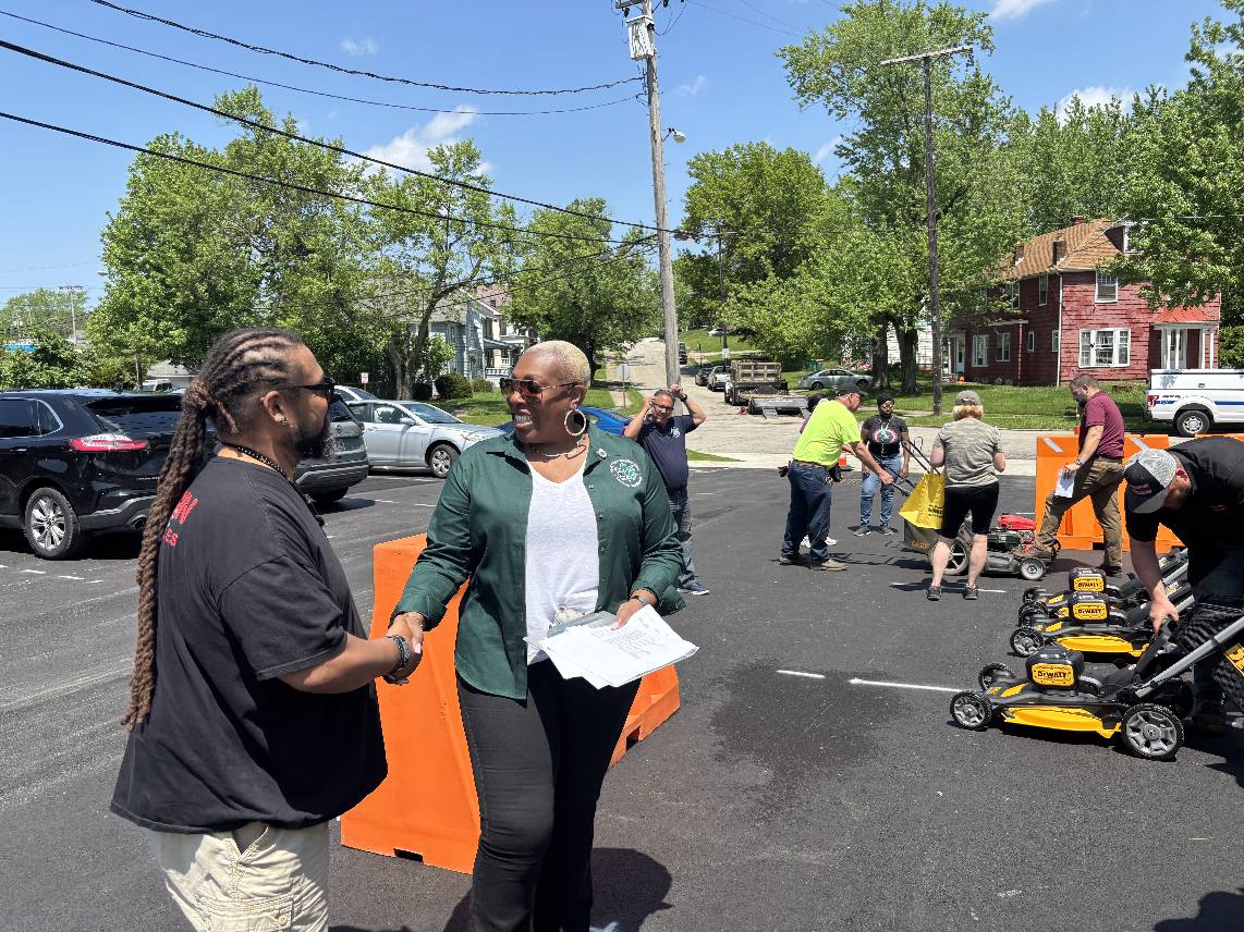 Mayor shakes hands with citizens